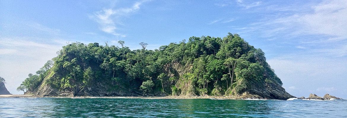 chora island viewed from a boat in june
