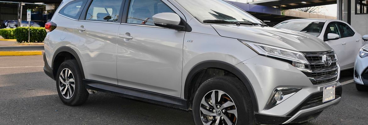 toyota rush vehicle rental car parked