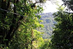 A tandem group rides in on the third longest cables, nearly 2,000 feet long, on April 17, 2013.