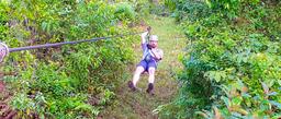 man zip linning on corcovado canopy tour