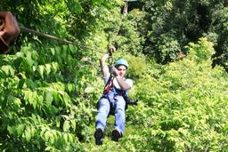man ziplining on suntrails canopy tour