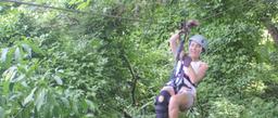 girl ziplining on canopy mal pais tour