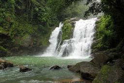 Water spills over the 60 foot Nauyaca falls outside Dominical on August 9, 2013. Horseback tours to the waterfalls include breakfast, lunch and cliff diving off the falls.