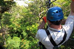 A man prepares for the first of 15 cables in Monteverde's longest canopy tour with Extremos on April 17, 2013.
