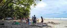 surfers leaving playa hermosa santa teresa
