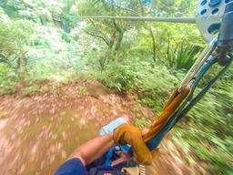 on a cable from land to the canyon entrance at the white river canyon zip line rincon de la vieja
