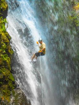 man rappelling down waterfall horseback rapelling tour rancho tropical matapalo jpg