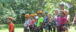 children listening to instructions to do canopy tour