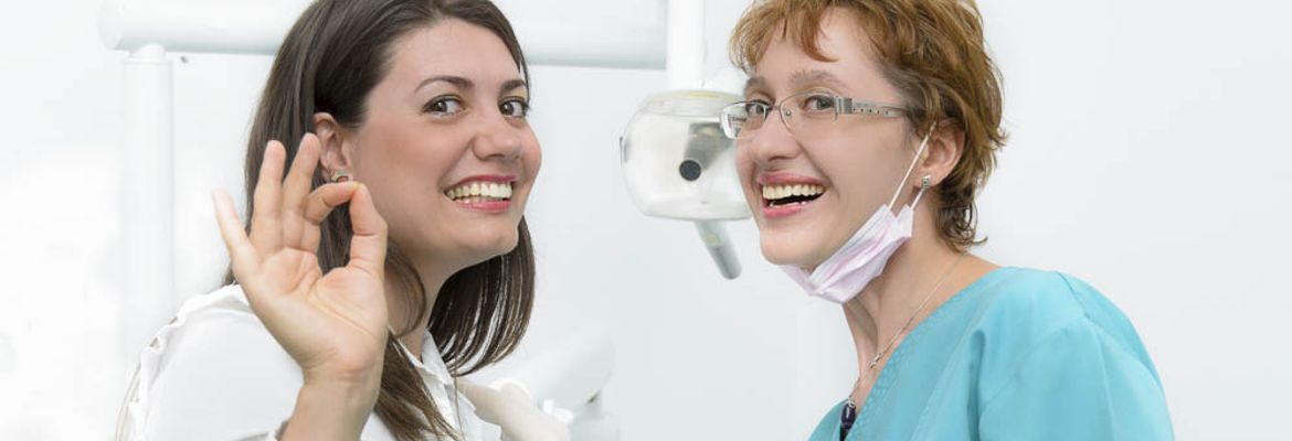 veneers happy young lady visiting her dentist