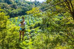lady zip lining the first cable osa palmas canopy tour