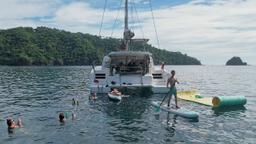 rear view with guests doing water activities 41 foot luxury charter catamaran guanacaste