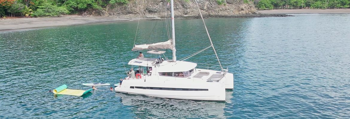 people on board aerial view 41 foot luxury charter catamaran guanacaste
