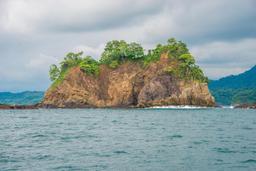 rocky island in the northern area of tamarindo bay from the marlin del ray catamaran