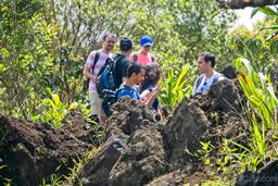 group of tourist taking pictures of the lava molten rocks at 1968 hiking trail
