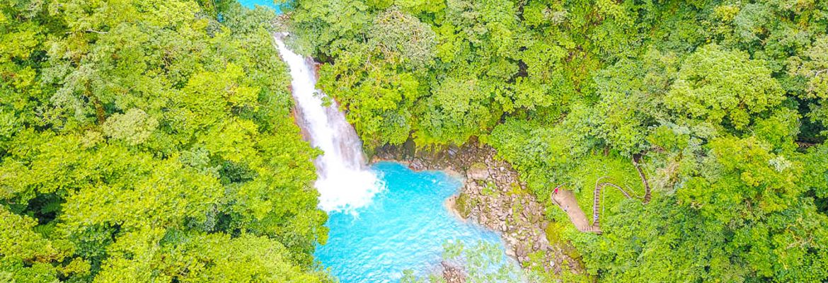 celeste river waterfall aerial view with step trail dji