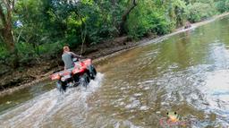 atv nosara tour crossing a creek