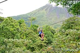 zip lining with arenal volcano base in the background los canones canopy tour la fortuna