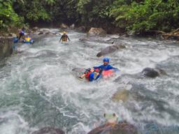 going down the currents of blue river on an inner tube rincon de la vieja