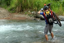 bamboo forest moutain bike tour crossing river 3