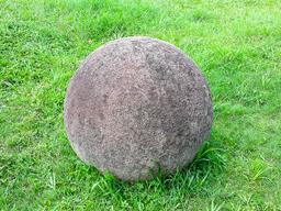 costa rica stone sphere on the grass at finca 6