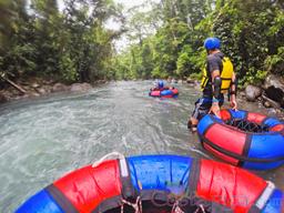 tubing in a section of calm water blue river rincon de la vieja