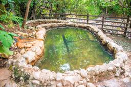 view of cement pool with a fence hot springs pools rincon de la vieja