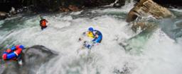 kid tubing in the rapids of blue river rincon de la vieja