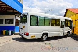 20 passenger coaster van back lateral view