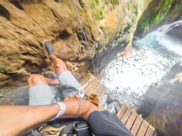 rappeling down with river view below white river canyon zip line rincon de la vieja