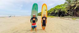 olingo tours surf lesson students holding board