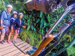 arrival at the first platform inside the canyon at the white river canyon zip line rincon de la vieja