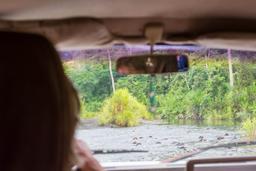 view from the car crossing a river to access los patos ranger station