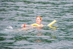 lady floating in playa huevos marlin del ray catamaran